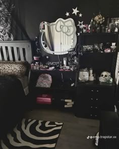 a black and white bedroom with zebra print rug