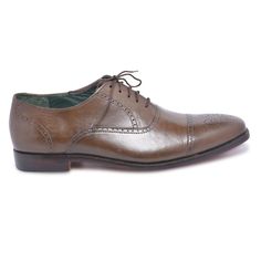 If you’ve been thinking which lace shoes to invest in, then look no further. These brown oxford capped toe brogue genuine leather shoes are more splendid than you ever imagined! The vamp covers the instep and toes, whereas the quarter wraps around the heel and joins the vamp in the middle of the foot. When it comes to versatility, elegance, and quality, you can never go wrong with these brown oxford capped toe brogue genuine leather shoes. Following are their features; Made of high-quality leather Capped toe with brogue design Oxford style handmade When it comes to style and quality, we guarantee you a great blend of both with this winning pair. Brown Cap Toe Oxfords With Brogue Detailing, Classic Derby With Cap Toe And Brogue Detailing, Classic Cap Toe Derby With Brogue Detailing, Classic Derby With Brogue Detailing And Cap Toe, Classic Derby Shoes With Brogue Detailing And Cap Toe, Brogue Detailed Oxford Shoes For Derby With Cap Toe, Derby Oxford Shoes With Brogue Detailing And Cap Toe, Oxford Lace-up Shoes With Brogue Detailing, Semi-formal Cap Toe Oxfords With Branded Insole