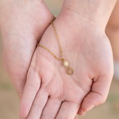 This delicately handcrafted Teardrop Necklace is perfect for layering but makes a statement all on its own. The teardrop pendant is anchored with a small stone as it sits on a delicate, adjustable brass chain. Part of our teardrop collection, this necklace pairs perfectly with our Teardrop studs, Teardrop hoops, or Teardrop Duster earrings. This necklace is handmade in our India Sanctuary. Wear or gift this necklace knowing that your purchase is supporting courageous women as they rebuild their Duster Earrings, Teardrop Necklace, Teardrop Pendant, Brass Chain, Layering, Brass, India, Chain, Stone