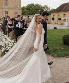 the bride and groom are walking down the aisle