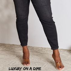 High-Rise Waist Black Denim Judy Blue Classic Skinny Jean Pants When it comes to jeans these have it all and more!High waist offers style, comfort and functionality while creating an elongated silhouette that enhances your curves while preventing muffin top.Slightly stretchy so you get that perfect fit every time.Skinny fit gives a sleek trendy look that works perfectly with heels or boots.Equipped with functional pockets, the belt loops offer the option to accessorize for a personalized touch.W Black Tapered Leg Cropped Jeans, Mid-rise Black Denim Jeggings, Black Stretch Denim Jeggings, Trendy Black Denim Jeggings, Black Cropped Denim Jeans, Black Tapered Leg Jeans For Spring, Fitted Black Cropped Denim Jeans, Trendy Non-stretch Tapered Leg Jeans, Trendy Black Tapered Leg Jeans