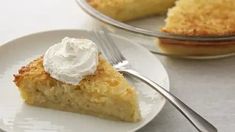 a piece of pie on a plate with a fork next to it and another slice in the background