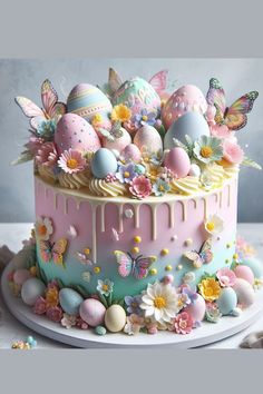 a cake decorated with flowers, butterflies and eggs