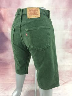 "Size 32 Vintage 501 Green Distressed Levis Cutoff Shorts - Made In USA, waist 32\" Large Brand: Levi's 501 Size On Tag marked 34 but fits more like 32\" waist, 11.5\" rise, 45\" hips, 12\" inseam,! Fits a size 32, but check your measurements and compare the measurement with your garment. (see full measurement below) Recommended waist size: 32\" (32\"x12\") Material :  Cotton 100% MADE IN USA . ----------------------------------------------- ✂ Measurement in inches: All measurements are taken wi Retro Straight Leg Shorts With Pockets, High Waist Green Jeans, Vintage Straight Leg Cotton Shorts, Fitted Green Jean Shorts With Pockets, Vintage Cotton Straight Leg Shorts, Green Short Jeans With Pockets, Vintage Short Cotton Pants, Vintage Cotton Short Pants, Vintage Cutoff Bottoms With Belt Loops