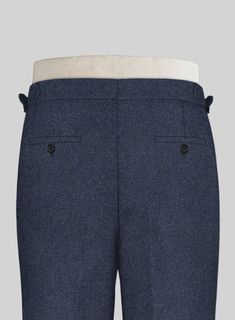 A genuine sartorial masterpiece, the Playman Blue Denim Highland Tweed Trousers stand out in the best way possible with its luxurious feel and solid flair. Crafted from wool, the sumptuous trousers will wow the crowd at off-duty weddings and party events. 
 
 Look Includes  Playman Blue Denim Tweed Fabric  Cross Pocket  Forward 2 Pleats  Side Tabs (No Loops)- Arrow Shape   Bottom Cuff (1.5")  Two Welted Back Pockets on Trousers   You can change the look during customization if required. 
 
 Lini Elegant Fitted Tweed Bottoms, Tailored Blue Wool Pants, Classic Bottoms With Herringbone Pattern, Formal Tailored Tweed Bottoms, Tailored Tweed Bottoms For Formal Occasions, Formal Tweed Tailored Bottoms, Fitted Denim Blue Bottoms With Welt Pockets, Formal Fitted Bottoms With Herringbone Pattern, Fitted Denim Bottoms With Welt Pockets