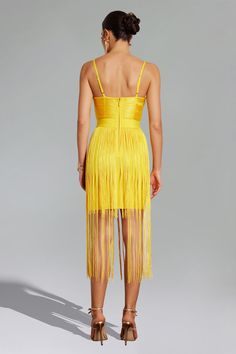 Sparkle and captivate with our Dizzt V Neck Fringe Dress! This dress exudes retro glamour with its eye-catching fringe detailing and plunging V-neckline. Combining playful movement with bold elegance, this strappy dress is perfect for evening events. Pair it with bold statement earrings and sleek metallic heels for a head-turning ensemble.    Model wearing size S  Model Stats:Height - 65.7”/167 cm Bust - 32.2”/82cm Hips - 33.8”/86 cm Waist - 25.5”/65 cm  Colour may vary d Glamorous V-neck Fringe Dresses, Elegant V-neck Mini Dress With Tassels, Fringe V-neck Dress For Night Out, Cocktail V-neck Mini Dress With Fringe, V-neck Fringe Mini Dress For Party, Party Mini Dress With Fringe And V-neck, Party Season Fringe Mini Dress With Spaghetti Straps, V-neck Fringe Dress For Party Season, Party Season Mini Dress With Spaghetti Straps And Fringe