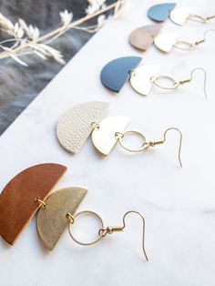 Cozy vibes in one of our best selling earrings shapes! This beige leather is soft, neutral and perfect for a delicate statement. •••••••••••••••••••••••••••••••••••••••••••••••••••••••••••••• • ORDERING • These leather earrings measure approx 1 1/2" wide, 2 3/4" drop with hook. These earrings come with raw brass or 14K gold fill hooks, and feature raw brass accents. Please note raw brass will naturally oxidize over time, creating a beautiful vintage like patina on your earrings. Each pair of ear Beige Dangle Jewelry For Everyday, Chic Brown Earrings For Everyday Wear, Chic Everyday Brown Earrings, Beige Dangle Earrings For Everyday, Adjustable Beige Earrings For Everyday, Everyday Beige Dangle Jewelry, Chic Brown Everyday Earrings, Minimalist Everyday Beige Jewelry, Everyday Minimalist Beige Jewelry