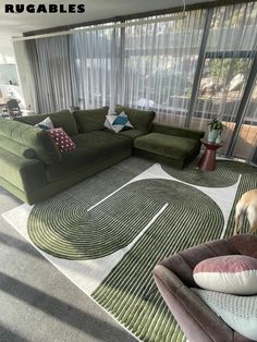 a living room filled with lots of green furniture