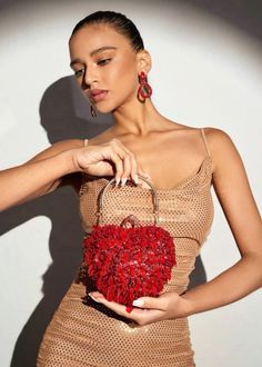 Expertly designed for a touch of romance, our Red Heart Shape Beaded Embroidery Evening Bag exudes elegance and sophistication. The mini size makes it perfect for any occasion, while the detachable chain shoulder strap adds convenience. Let this bag elevate your ensemble with its stunning beaded embroidery. Novelty Bags, Elegant Red, Red Pattern, Red Heart, Metal Decor, Beaded Embroidery, Evening Bags, Free Gifts, Heart Shapes