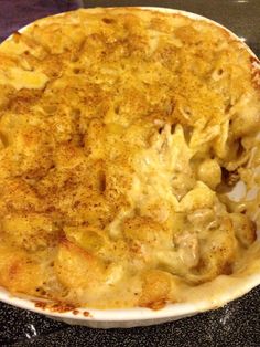 a casserole dish with chicken and cheese