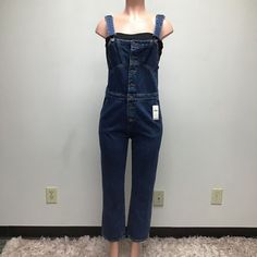 Anthropologie Blue Sleeveless Square Neck Button Denim Jumpsuit Overalls 27 $365 Brand: Anthropologie Style: Jumpsuit /Overalls Color: Blue Material: 100% Cotton * Measurements: Please See Photos For All Measurements And Note Sometimes The Measurements I Take May Differ Slightly From The Measurements On The Brand Tag. This Is Due To The Way I Measure Versus The Manufacturer. Please Compare Something You Own That Fits The Way You Love To The Measurements Listed To Confirm Fit Prior To Purchasing. Denim Overalls With Buttons For Work, Denim Jumpsuit With Bib Front For Workwear, Denim Bib Front Jumpsuits And Rompers, Dark Wash Denim Bib Front Jumpsuit For Work, Dark Wash Denim Jumpsuit For Workwear With Bib Front, High Rise Denim Blue Jumpsuit With Button Closure, Dark Wash Denim Jumpsuit For Work, Sleeveless Denim Jumpsuits And Rompers For Work, Sleeveless Blue Jumpsuits And Rompers With Button Closure