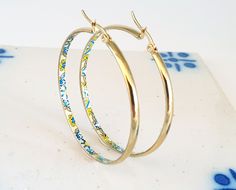 Hoop Tile Earrings Handmade with Stainless Steel in Gold Finish and Portuguese Yellow Tiles Pattern, on the inside of the hoops, making it an elegant but still statement piece.  These hoop earrings are made with Portuguese Tiles pattern that makes a beautiful portuguese tile jewelry gift suggestion for anniversaries, birthday's, mother's day, Christmas gift giving or any other special occasion. Very lightweight but catchy, suitable for summer and sunny days. Winter days are great to wear them too, but avoid water, lotions, perfumes or makeup, due to the nature of the handmade work 😊 ⭐ Dimensions: - 5 cm diameter wide, or 2 inches ⭐ Main Features: * Featured Original Jewelry * Gold Stainless steel * Unique patterns and designs * Anti allergic * Light Weight  * Durable * Ethical Jewelry To Yellow Metal Hoop Earrings As Gift, Gold Hoop Earrings For Jewelry Making, Yellow Tiles, Tile Jewelry, Tile Earrings, Tiles Pattern, Yellow Tile, Portuguese Tile, Branch Necklace