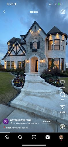 a house with lights on and steps leading up to the front door is shown in this screenshot