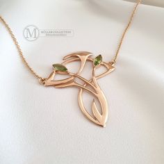 Extravagant Art Nouveau necklace made of high-quality 925 silver plated in rose gold with two incorporated peridot gemstones measuring 8 x 4 mm. This impressive Art Nouveau necklace, inspired by historical models, shows a high level of genuine craftsmanship and attracts everyone's attention. The necklace impresses with its typically curved lines in high-gloss rose gold. The pendant is completed by two incorporated peridot gemstones, which are faceted and make the necklace shine. The pendant is a Luxury Peridot Jewelry For Gifts, Art Nouveau Rose Gold Jewelry As A Gift, Art Nouveau Rose Gold Jewelry As Gift, Art Nouveau Rose Gold Jewelry For Gift, Rose Gold Art Nouveau Jewelry For Gift, Art Nouveau Rose Gold Jewelry Gift, Gold Art Nouveau Necklace With Gemstone, Art Nouveau Gold Necklace With Gemstone, Luxury Gold Peridot Jewelry