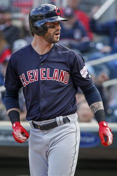 a baseball player is walking on the field