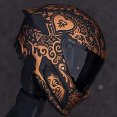 the helmet is decorated with intricate designs