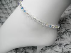 "Length: 8.5\" - 10.5\" Please specify length and components color desired (silver or gold) at drop down menu Sparkly Swarovski Crystal AB Anklet/Ankle Bracelet Simple. Chic. Elegant. Affordable. Appropriate for any woman who wants to dress up her ankle with a bit of bling! So much prettier to see in person! NOTE: I have many more crystal colors to choose from, so please send me a convo and together we can work on the perfect color(s) for you! Composition: Premium Swarovski Crystallized Elements Elegant Crystal Anklets For Wedding, Wedding Silver Crystal Anklets, Crystal Anklets For Parties, Adjustable Cubic Zirconia Anklets For Gift, Adjustable Nickel-free Crystal Bracelet For Party, Sister Bride, Wedding Anklets, Beach Wedding Gifts, Crystal Colors