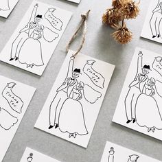 several cards with drawings of people on them