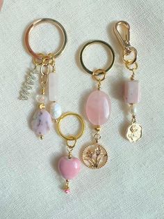 four different types of key chains on a white surface