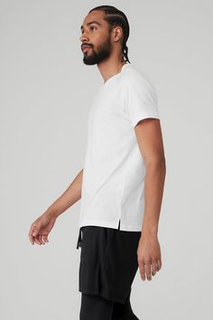 A short-sleeve staple, the Triumph Crew Neck Tee is soft enough to wear all day, every day. A slim, relaxed fit and classic crew neck make it the most versatile piece in your closet. Made for movement from studio to street Soft, versatile tri-blend jersey Designed & uniquely fit for every size Wear-tested by our in-house team for the perfect fit Triumph Crew Neck T-Shirt in White, Size: Small | Alo Yoga® Athleisure Short Sleeve T-shirt For Everyday, Modern Crew Neck T-shirt For Everyday, Alo Yoga Relaxed Fit Cotton Top, Casual Solid Color Tops By Alo Yoga, Casual Alo Yoga Tops, Sporty Crew Neck T-shirt For Everyday, Sporty Relaxed Fit T-shirt With Shirttail Hem, Alo Yoga Athleisure Tops For Streetwear, Alo Yoga Athleisure Streetwear Tops