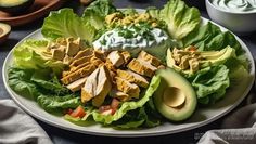 a white plate topped with lettuce, chicken and avocado