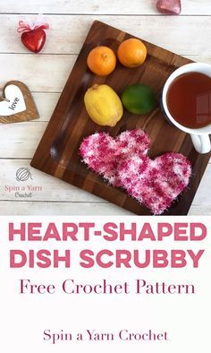 heart shaped dish scrubby on a wooden cutting board with fruit and tea next to it