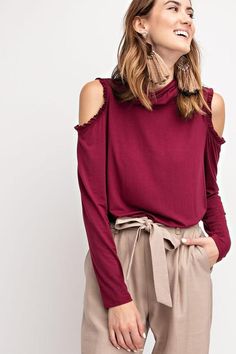 Our favorite sign of fall and winter, off-the-shoulder styles like our Ruffle Loose Fit Tunic Long Sleeve Blouse. Celebrate fall and winter days with this skin-baring top, designed with a flattering ruffle around the shoulders, and full sleeves. A loose and stretchy tunic long sleeve top that can be easily matched with a variety of bottoms in your wardrobe, instantly giving any outfit a fashionable lift. Featured mock neck, ruffle hem cold shoulder, loose fit, Great Stretch Color - Plum Measurem Trendy Off-shoulder Top For Fall, Trendy Ruffled Tops For Fall, Trendy Long Sleeve Off-shoulder Top For Fall, Chic Fall Off-shoulder Top, Chic Off-shoulder Top For Fall, Fall Peasant Top With Smocked Cuffs, Chic Off-shoulder Long Sleeve Top For Winter, Trendy Off-shoulder Long Sleeve Top For Fall, Trendy Fall Off-shoulder Long Sleeve Top