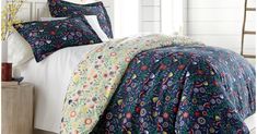 the comforter is made up with colorful flowers