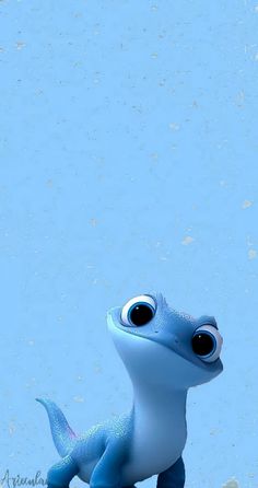 a small blue toy with big eyes sitting on the ground