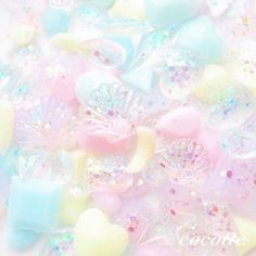 pastel hearts and stars are scattered on a white background