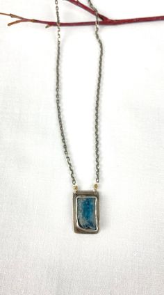 I openly admit, Kyanite is one of my favorite gemstones. That denim blue that comes in so many shades - all of them irresistible (in my opinion). Encased in a handcrafted setting of sterling silver with a soft gray patina, this stone hangs from a silver chain made in Bali. This necklace is a keeper! Approximately 19.5 inches long with a silver toggle clasp. Free Shipping in the USA! Shipped in a gift box ready for giving. Due to the custom nature of these earrings, no two are alike. Slight varia Blue Patina Necklace Perfect For Gifts, Gift Blue Patina Necklace, Unique Blue Necklace With Patina, Blue Sterling Silver Fusion Necklace, Blue Oxidized Pendant Jewelry, Blue Sterling Silver Jewelry With Oxidized Finish, Blue Oxidized Sterling Silver Jewelry, Artisan Blue Jewelry With Oxidized Finish, Blue Oxidized Necklace For Gift