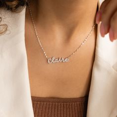 Our Pave Dream Script Name Necklace combines personalized charm with a touch of glamour. Featuring a dainty mirror chain with your chosen name or word in a delicate pavé setting, this elegant necklace is a stunning way to wear a name with pride and style. Wear it alone for a subtle statement or layer it with other necklaces to enhance its glowing effect ♡ SKU: MM-NM160F106 Product Details Material: High Quality Solid 925 Sterling Silver Finish: Sterling Silver ∙ 18K Gold ∙ Rose Gold Dimensions: Elegant Nameplate Charm Necklace, Dainty Charm Necklaces With Names, Elegant Necklaces With Names, Delicate Silver Name Necklace With Delicate Chain, Delicate Name Necklace With Delicate Chain, Elegant Name Pendant Necklaces, Elegant Name Pendant Necklace, Silver Name Necklace With Delicate Chain For Anniversary, Elegant Silver Name Necklace With Adjustable Chain