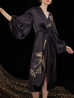 Elevate your special moments with our exquisite "Oriental Phoenix Lantern Dress." This dress is more than just fabric and design; it's a piece of art that encapsulates the essence of beauty and grace. Luxurious Stretch Satin: Crafted from the finest stretch satin, this dress drapes you in opulent comfort. It offers a gentle stretch, ensuring a flattering fit that accentuates your curves. Maxi Length: With its flowing silhouette, this dress commands attention. The long, sweeping lines add a touch Black Silk Dress With Kimono Sleeves, Elegant Black Dress With Kimono Sleeves, Lantern Dress, Beauty And Grace, Dress Drape, Dress Home, Lingerie Accessories, Stretch Satin, Long Bridesmaid Dresses