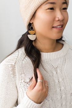 Cozy vibes in one of our best selling earrings shapes! This beige leather is soft, neutral and perfect for a delicate statement. •••••••••••••••••••••••••••••••••••••••••••••••••••••••••••••• • ORDERING • These leather earrings measure approx 1 1/2" wide, 2 3/4" drop with hook. These earrings come with raw brass or 14K gold fill hooks, and feature raw brass accents. Please note raw brass will naturally oxidize over time, creating a beautiful vintage like patina on your earrings. Each pair of ear Trendy Adjustable Beige Earrings, Trendy Beige Drop Earrings, Minimalist Everyday Cream Jewelry, Everyday Minimalist Cream Jewelry, Chic Brown Earrings For Everyday Wear, Chic Beige Dangle Jewelry, Chic Everyday Brown Earrings, Chic Brown Everyday Earrings, Beige Dangle Jewelry For Everyday