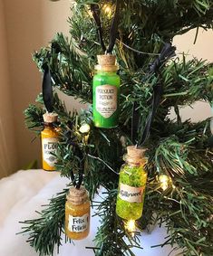 christmas tree decorated with jars filled with condiments and lights hanging from the branches