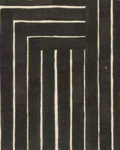 a black and white striped rug with vertical lines on the bottom, diagonally drawn