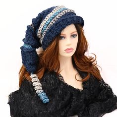 "Make winter fun with this chunky thick warm mountain ski snow hat. A little witchy, a bit of elf, and dark blue in color. I've crocheted this with bands of contrasting color and ridges. 21\" long from the top to the brim with a matching corkscrew tip, this hat is soft and can be shaped, tucked, or worn straight out. Certain to add character to your outdoor wear or gift to a friend who just loves fun things. Lots of stretch, so one size will fit most. Machine wash cold, lay flat to dry." Witchy Brimmed Winter Costume Hats And Headpieces, Witchy Wide Brim Hat For Winter, Witchy Wide Brim Winter Costume Hat, Witchy Brimmed Costume Hat For Winter, Witchy Wide Brim Costume Hat For Winter, One Size Winter Cap, Winter Brimmed Hat One Size, Witchy Hat With Curved Brim For Winter, Witchy Brimmed Winter Hats