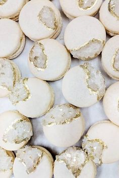 some kind of food that is on a white counter top with gold leafy toppings