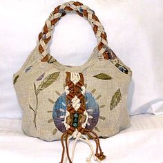 Macram Vintage Style Shoulder Bag - Retro Bohemian Bag A Bit Of Beautiful Macram And Beads Added To This Bag. Braided Handle/Straps, Very Earthy Colors. Beautiful Bag For The Fall Season. Brand New In Package. Lots Of Pockets Including Front & Back. Description Unique Design: Vintage Floral Embroidery And Retro Western Style Make This Tote Bag Stand Out From The Crowd. Spacious: Large Enough To Carry All Your Essentials, This Hobo Bag Is Perfect For Everyday Use. Versatile: Can Be Used As A Handbag Or A Purse, Making It A Great Addition To Your Collection. High-Quality Material: Made With Durable Materials To Ensure Long-Lasting Use. Bohemian Chic: Perfect For Addi Beige Bohemian Hobo Bag, Bohemian Beige Hobo Bag, Bohemian Cream Hobo Bag For Travel, Bohemian Shoulder Bag With Braided Handles For Everyday, Bohemian Braided Beige Bag, Bohemian Braided Rectangular Bag, Bohemian Braided Shoulder Bag, Bohemian Hobo Bag With Braided Handles For Daily Use, Bohemian Bags With Braided Handles For Everyday Use