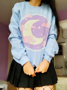 The Crescent Moon Sweatshirt is a soft and comfortable piece of clothing made of 50% cotton and 50% polyester. The shirt has a loose fit and comes in a variety of colors. The durable print will last for years to come. 100% No Sweatshops & Eco-Friendly tees ♥ THANKS FOR LOOKING ♥ If you like this design please come check out my store by clicking the link below. If you have any questions, feel free to ask! https://www.etsy.com/shop/GemCafe Check out our Sister store https://www.etsy.com/shop/MassCtrl ** We accept returns if there has been a printer error. Unfortunately we do not issue returns on consumer end problems (ordered wrong size, doesn't like design/color, wrong address, etc.) Long Sleeve Cotton Top For Cosplay, Blue Harajuku Cotton Sweatshirt, Blue Harajuku Style Long Sleeve Sweatshirt, Blue Long Sleeve Harajuku Sweatshirt, Blue Cotton Harajuku Sweatshirt, Purple Harajuku Crew Neck Top, Kawaii Long Sleeve Tops With Anime Print, Blue Long Sleeve Kawaii Sweatshirt, Fairy Grunge Long Sleeve Winter Tops