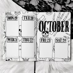 a black and white photo of an open notebook with the words october written in it