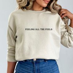 Elevate your style and spread a powerful message with our 'Feeling All the Feels - Your Feelings Are Valid' Women's Sweatshirt - a thoughtful gift for her or him! This cozy sweatshirt not only delivers warmth but also raises awareness for mental health and self esteem. A perfect choice for those passionate about therapy and supporting mental well-being. Wear your heart on your sleeve and make a statement with this comfortable and meaningful Mental Health Shirt. Meaningful Text Print Crew Neck Tops, Inspirational Crew Neck Top With Quote Print, Inspirational Quote Print Crew Neck Top, Relaxed Fit Crew Neck Top With Quote Print, Inspirational Slogan Long Sleeve Tops, Inspirational Long Sleeve Slogan Tops, Masculine Fits, Be Kind To Your Mind, Self Love Club