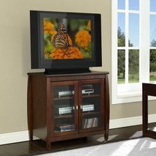 a living room scene with focus on the entertainment center and butterfly sitting on the screen