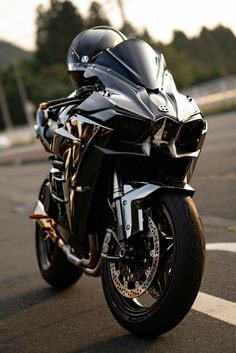 a black motorcycle parked in a parking lot