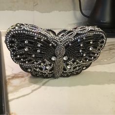 Swarovski Crystal Elements Black & Silver Crystals Butterfly Bag! Secure String Magnetic Closure! Heavy! Top Quality! Clutch Bag Is 7” High By 3 7/8” Long! Inside Is About 3” Deep! Bag Has Never Been Used! Free First Class Domestic Shipping! Will Be Packed & Shipped W Care! We Double Box All Our Crystal Bags! Luxury Black Evening Bag As Gift, Designer Black Evening Bag As Gift, Designer Silver Clutch For Formal Events, Designer Silver Clutch For Formal Occasions, Elegant Silver Bag For Night Out, Designer Black Evening Bag For Events, Black Rhinestone Clutch For Party, Luxury Black Embellished Clutch, Designer Embellished Silver Evening Bag