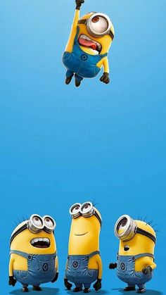 three minion characters flying in the air