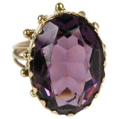 Stunning 14K Gold Setting with an oval Amethyst stone Approximately 9.25 Carats. This sits up off you finger .45 in. The ring is a size 7.5 and can be sized by your jeweler or by us. This is out of a massive collection of New Old stock items as well as Hopi, Zuni, Navajo, Southwestern, sterling silver, (costume jewelry that was not worn) and fine jewelry we have both on fashion and the fine jewelry platforms. Be sure to check our storefront for more fabulous pieces from this collection. We have Antique Amethyst Jewelry, Yellow Gold Amethyst Ring, Rings Purple, Oval Amethyst Ring, Gold Amethyst Ring, Claw Ring, Purple Amethyst Ring, Amethyst Gold, Jewelry Wedding Rings