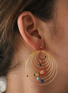 a pair of beautiful handmade solar system earrings  made of gold plated sterling silver and stone beads  bright and noticeable but yet lightweight  the largest hoop diameter is 4 cm Funky Jewelry, Ear Rings, Gold Accessories, Bijoux Diy, Jewelry Inspo, Pretty Jewellery, Star Earrings, Solar System, Bling Bling