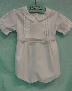 "This is a very cute little vintage baby or doll/teddy romper. There is no label but it is 18\" in length and 10\" across shoulders in back. It is bright white cotton with wonderful sewing details. There is embroidery on the collar and front, tucks and fancy stitching and a belt that fastens in back with two buttons. There are also two buttons in back and at the crotch. It is in excellent clean condition with no marks or flaws. I combine shipping and am happy to provide a shipping quote to inter Newborn Vintage Outfit, Vintage Newborn Clothes, Vintage Baby Gear, White Baby Pajamas, White Long Sleeve Playwear For Babies, Aesthetic Galaxy, Romper Suit, Gender Neutral Baby Clothes, Baby Romper