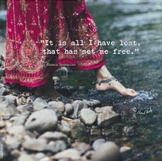 a woman's feet in the water with a quote on it that says, what is all i have lost, that has set me free